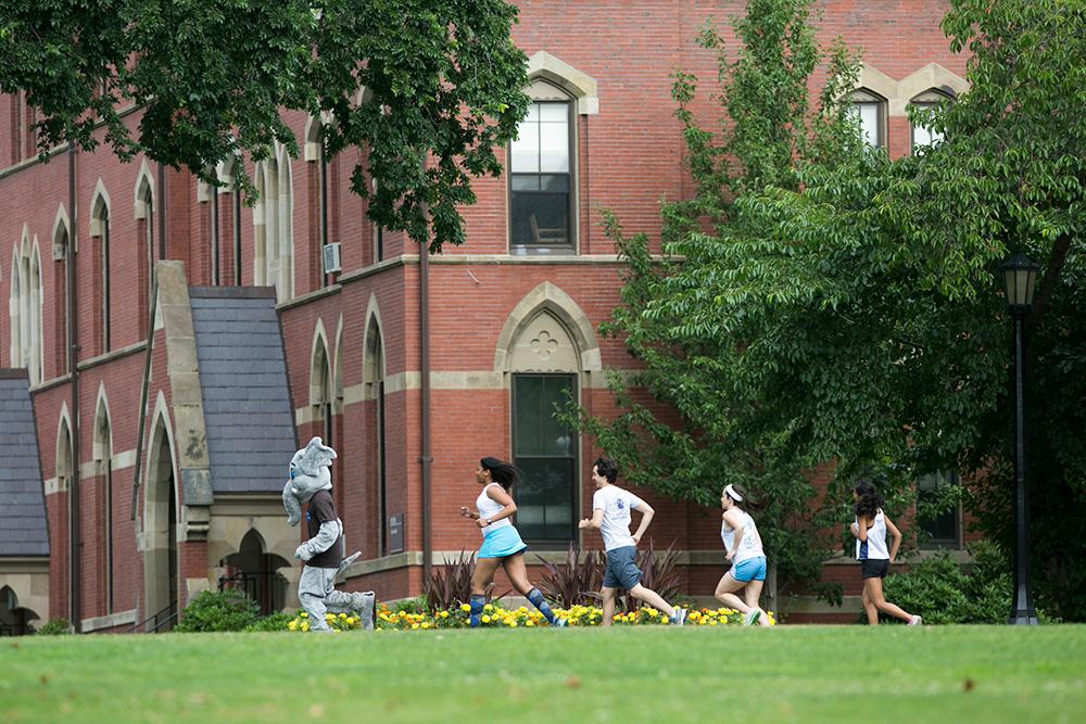 Students running on a field, related to longitudinal health study