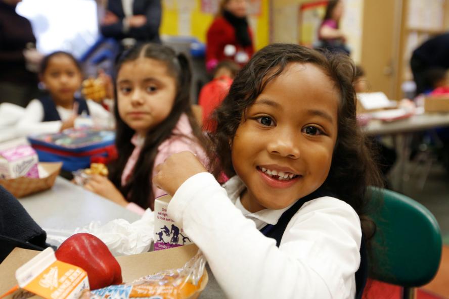 Children eating breakfast in a cafeteria