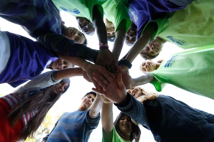 Group of children joining hands in a circle