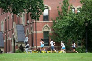 Students running on a field, related to longitudinal health study